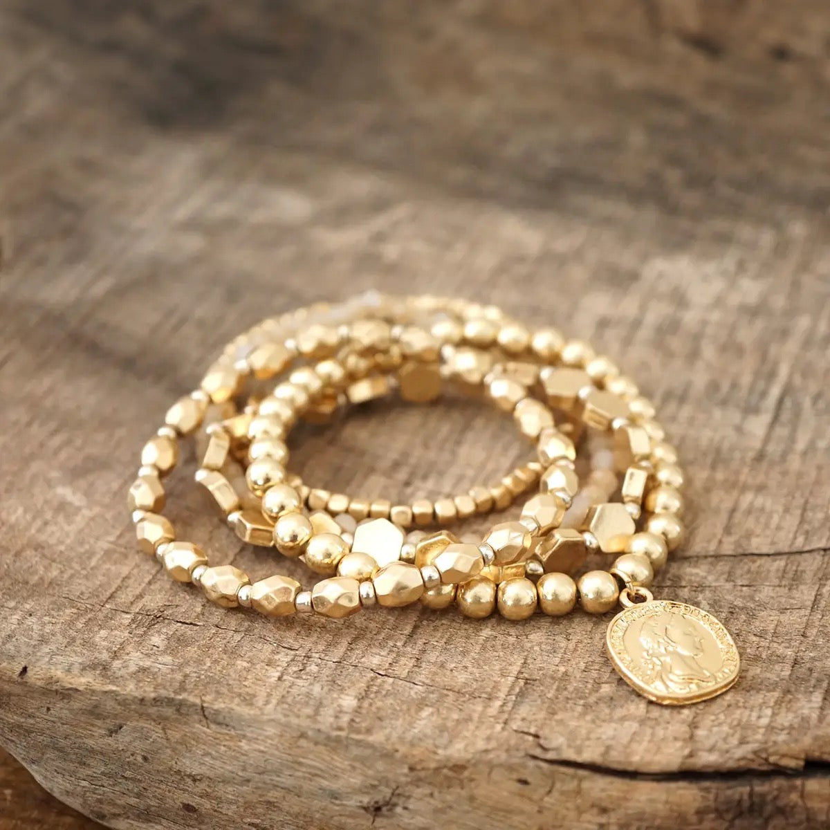 Worn Gold Coin Bracelet Stack