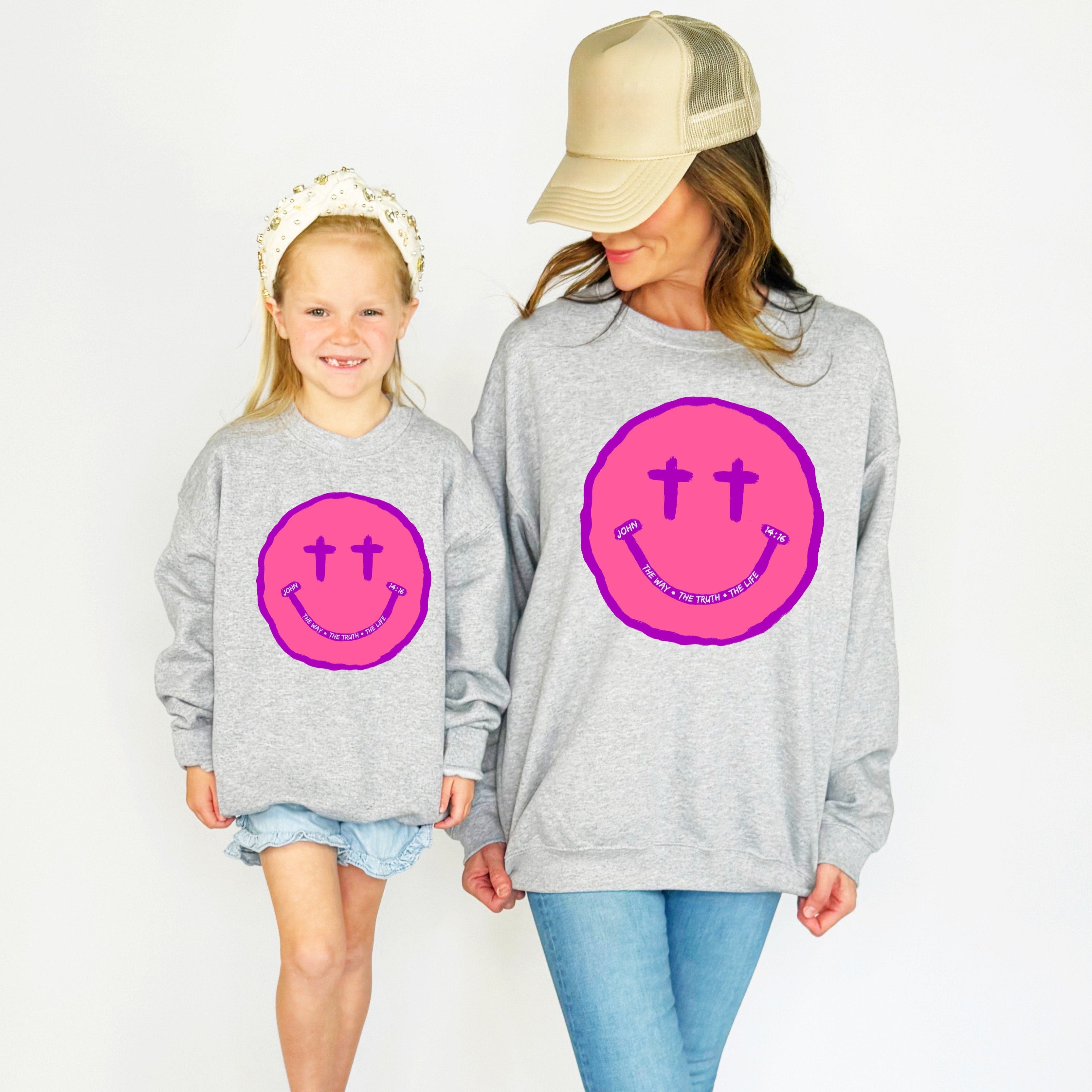 SMILEY CROSS EYES YOUTH AND ADULT SWEATSHIRT